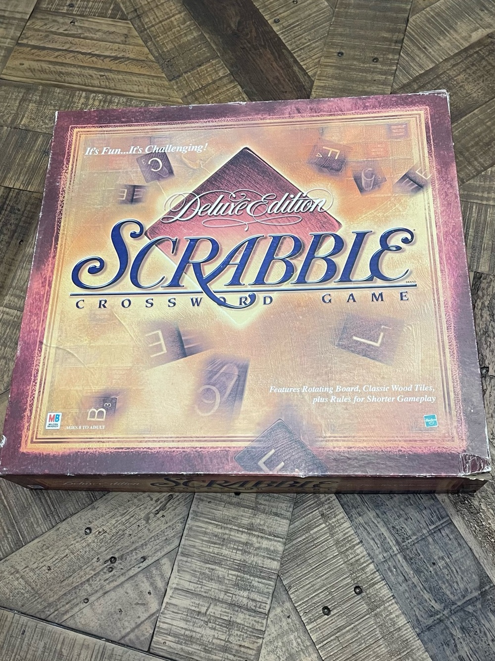 Scrabble Deluxe Edition features a wooden turntable board for rotating gameplay